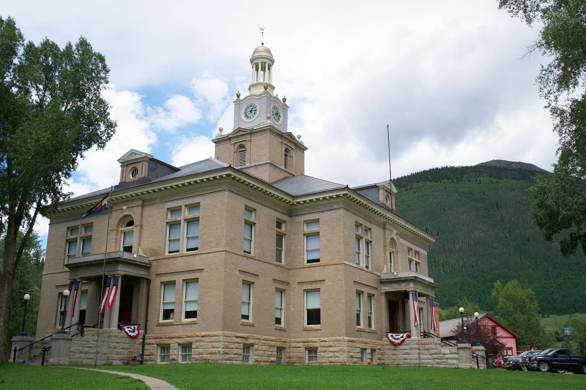 The classic architecture of San Juan County Courthouse in Silverton, Colorado, nestled in a mountain town setting.
